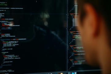 Person looking at coding on a screen