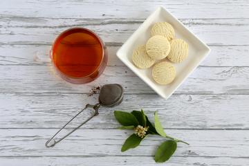 Photo of a cup of tea and biscuits