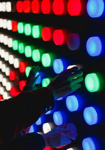 People holding assorted colour led lights
