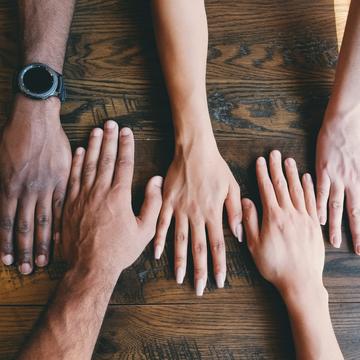 Photo by Clay Banks on Unsplash 5 hands on a table