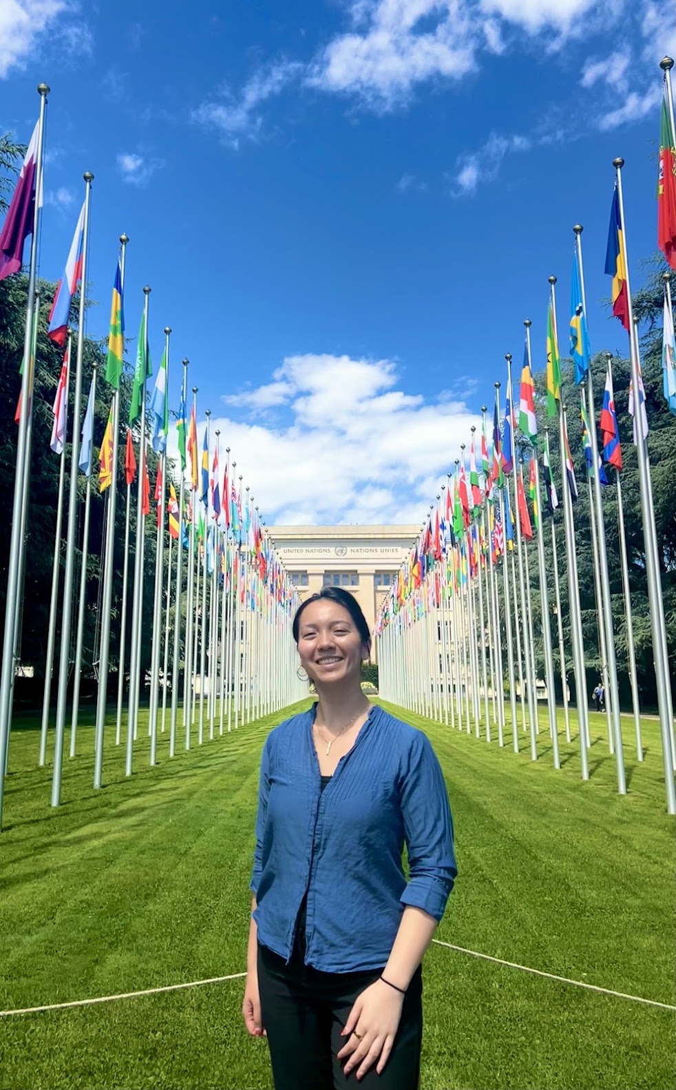 The author in front of flags at the ILO headquarters