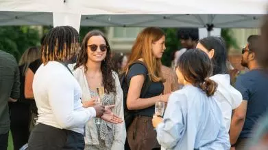 GUDTP Students chatting and drinking