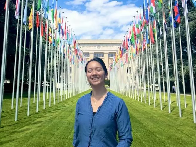 The author in front of flags at the ILO headquarters