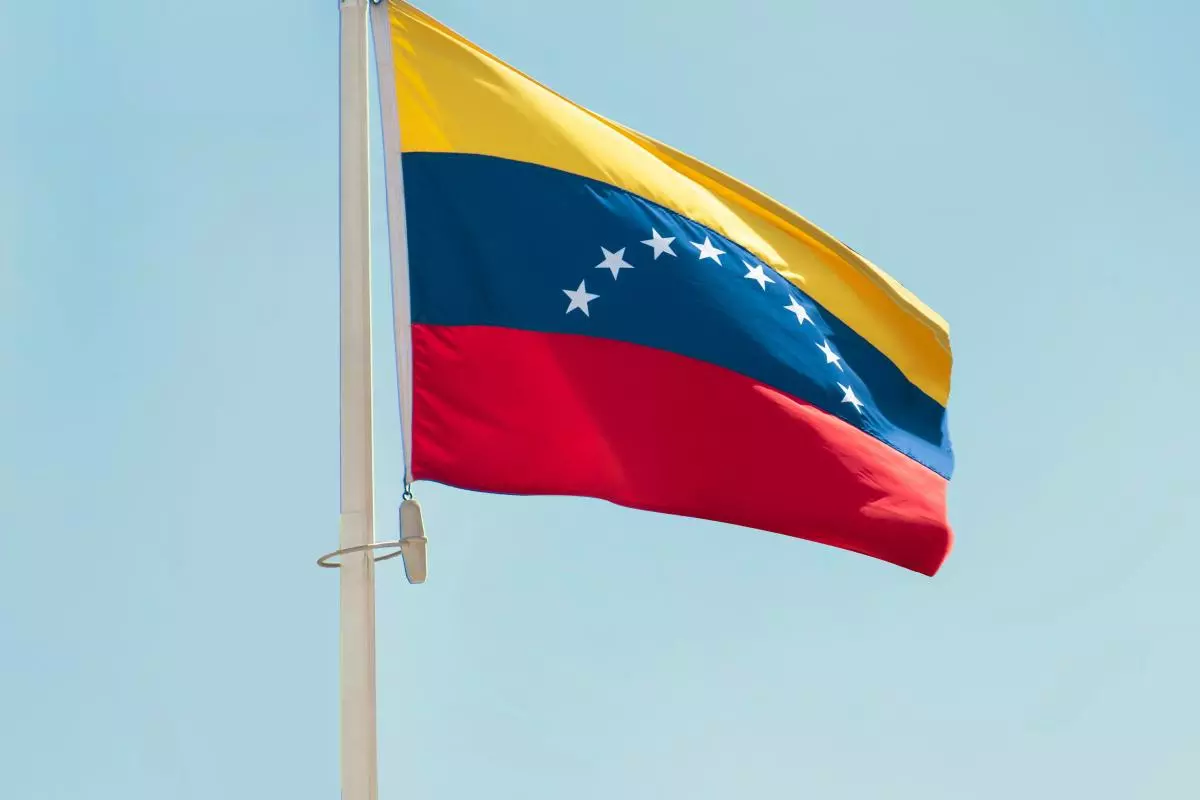 The flag of Venezuela against the blue sky