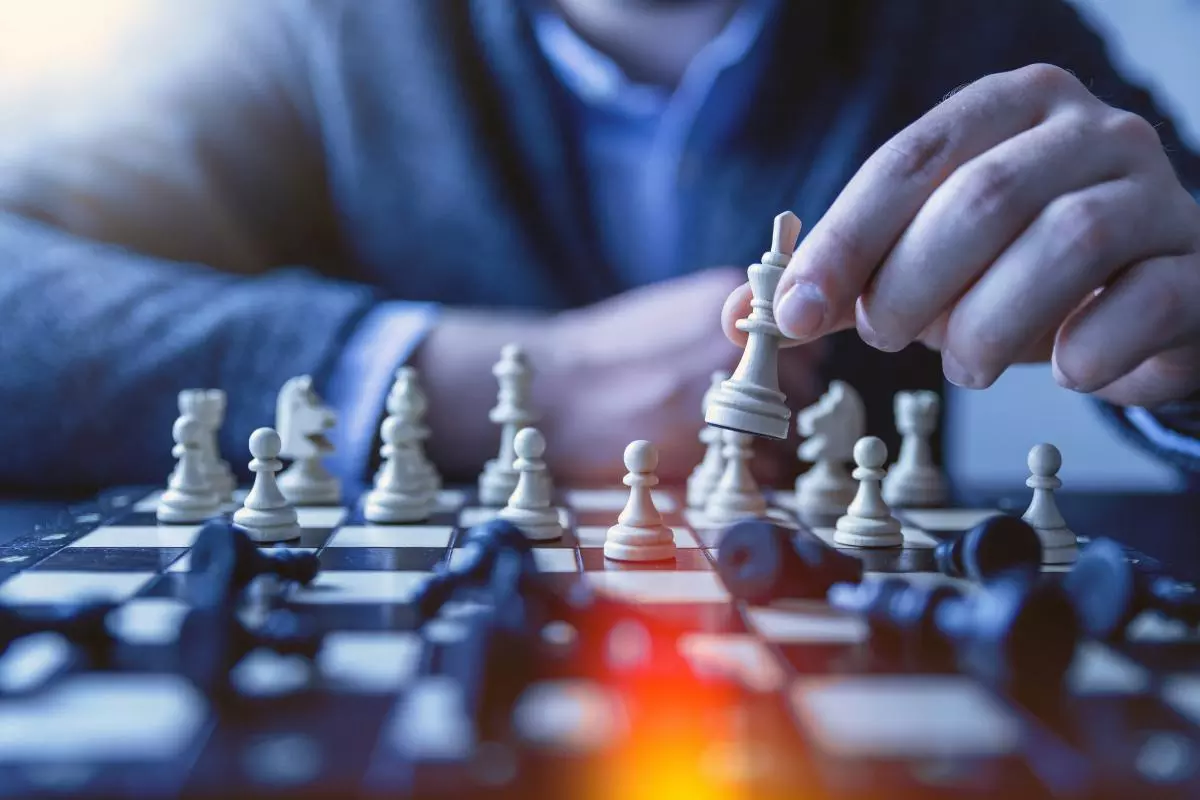 Close up of a man playing chess